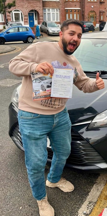 Client celebrating with his practical test pass certificate